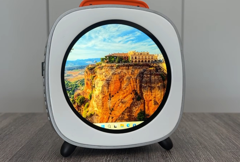 Homepage 2026 2 Piston V mini PC with front touchscreen displayed on a desk