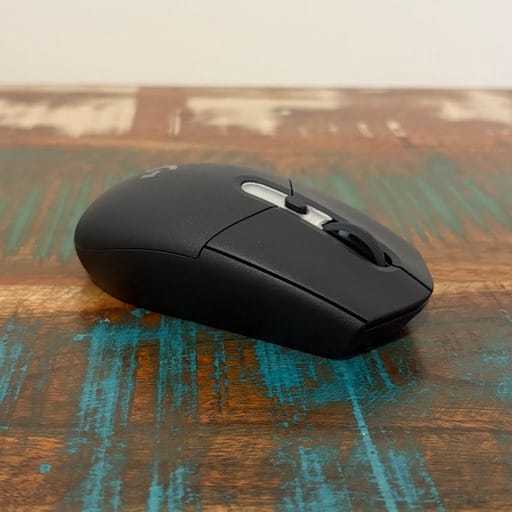 Black computer mouse, side angle view