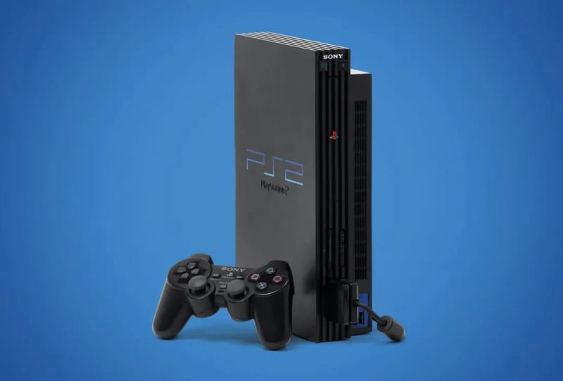 Close-up of a PlayStation 2 motherboard showing the PS2 MechaCon chip beside the optical drive controller