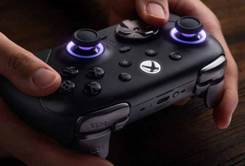 8BitDo Ultimate 3E controller shown with its modular ABXY buttons and charging dock