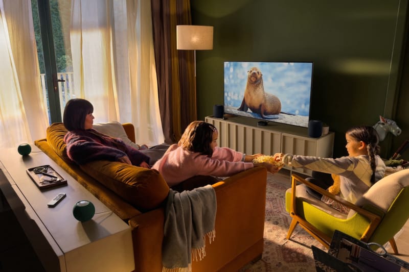 Apple TV 4K Siri AI interface shown in full screen on a living room television