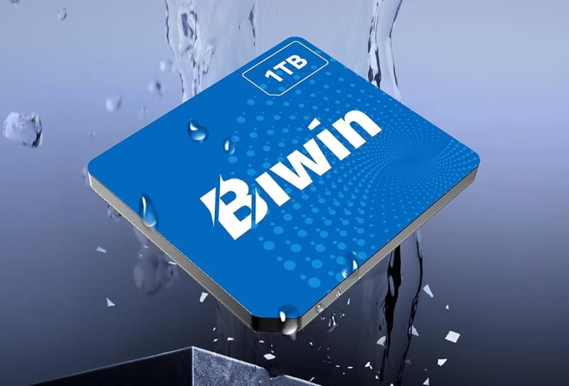 BiWin CL 100 Mini SSD chip shown next to a coin to illustrate its tiny 15 by 17mm size