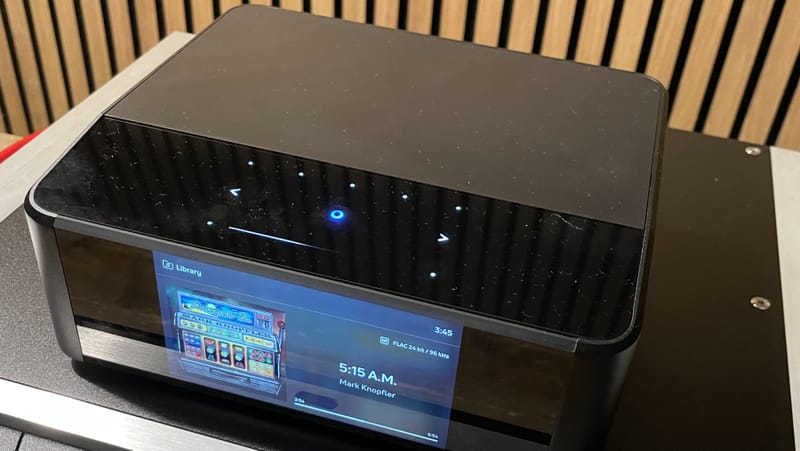 Bluesound speaker displaying the BluOS app with Bluesound Apple Music integration active