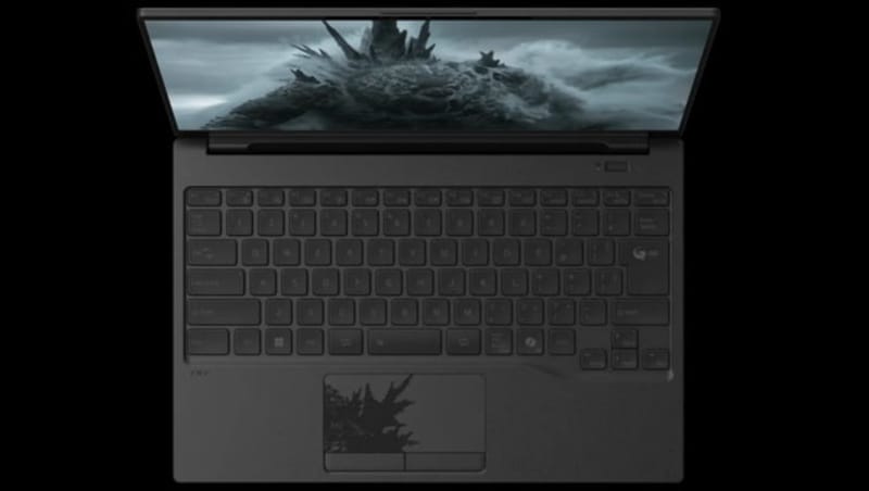 Fujitsu Godzilla laptop lid showing a black Godzilla illustration and dorsal fin shaped touchpad