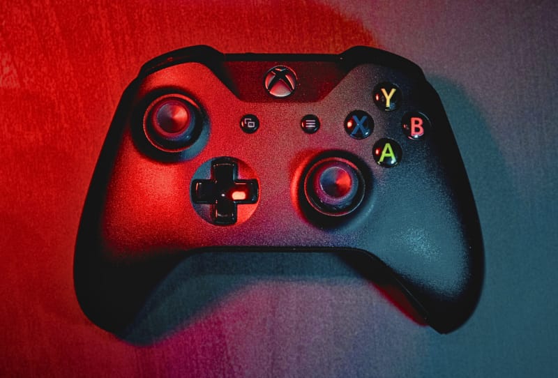 Homepage 2026 8 Sailor holding an Xbox-style controller used to operate the Navy laser weapon system on a ship
