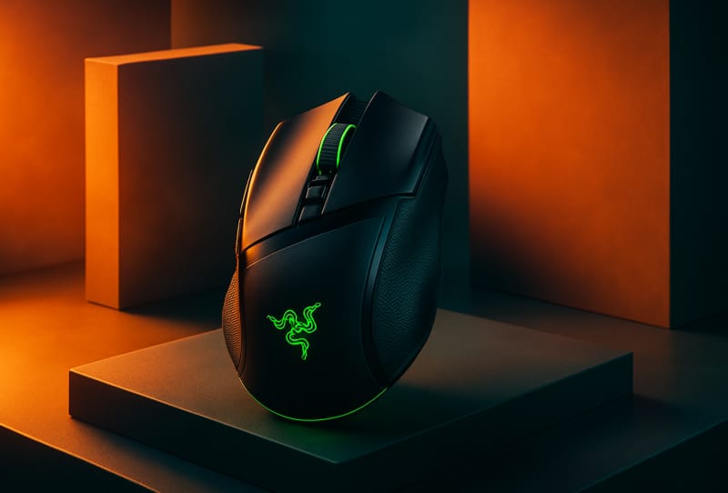 Razer Basilisk V4 Pro gaming mouse shown beside its Mouse Dock V2 Pro charging dock