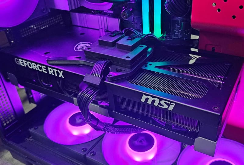Homepage 2026 1 MSI GeForce RTX 5090 graphics card with a modified RTX 5090 power connector featuring two extra 8-pin PCIe sockets