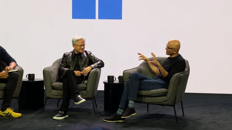 Nvidia and Microsoft executives presenting RTX Spark Builder PCs onstage at a joint keynote